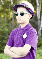 Boy with glasses  hat summer day  woods, outdoors resting one confident little man fashion style concept idea, shirt