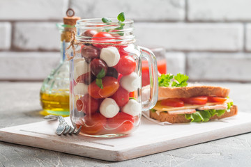 Caprese in a jar for lunch.