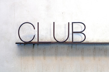 written club on the wall