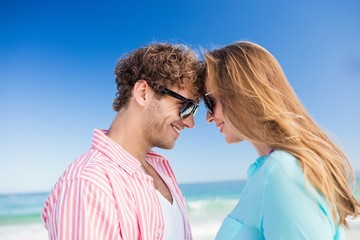 Happy couple posing on the beach 