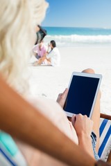 Young woman using digital tablet