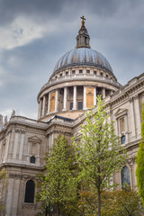 Portrait view of St Paul's Cathedral London with cloudy sky.