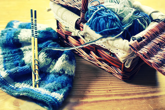 toned wool and knitting needles