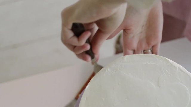 Woman is making cakes in the kitchen