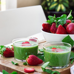 Green spinach smoothie with strawberry