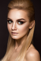 Fototapeta premium Beautiful woman with evening make-up, long straight hair . Smoky eyes. Fashion photo.