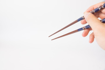 箸を持つ手 / Chopsticks and hand