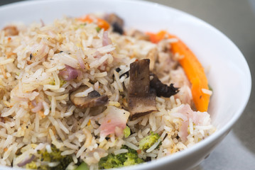 Plate with asian cook rice and vegies