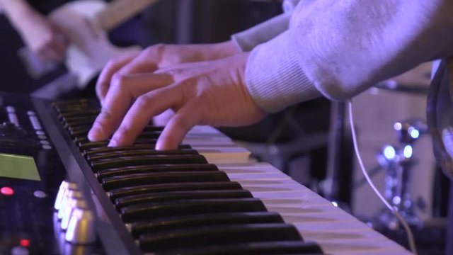 Men's hands played on the keys