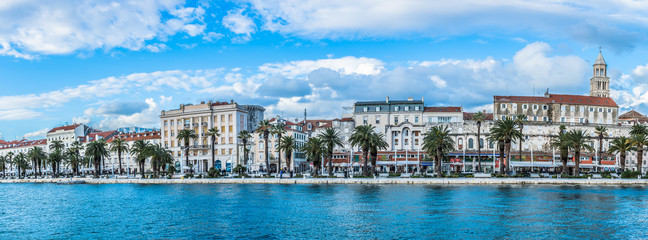 Obraz na płótnie Canvas Panorama Split Croatia waterfront. / Panorama of town of Split, waterfront view at riva (promenade) and walls of Diocletian Palace, old city center, Croatia.