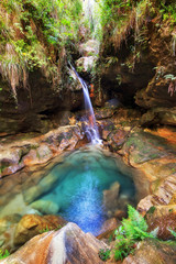 Fototapeta premium Beautiful river and cascade in a canyon in Isalo national park, Madagascar