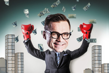 funny businessman with big head wearing Boxing gloves