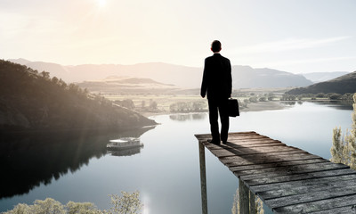 Fototapeta premium Businessman stand on berth