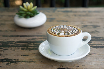 cups of mocha coffee on wooden tablee