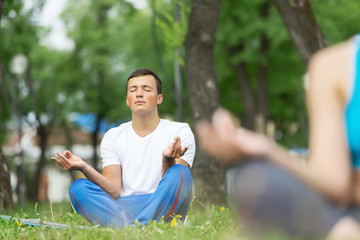 Fototapeta premium Having yoga practice in park