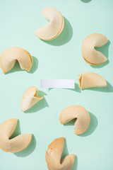 Fortune cookies on the green background - obrazy, fototapety, plakaty