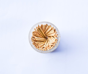 Toothpicks in a box on a white background