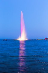 Fountain illuminated in the marine bay Baku. The height of the fountain - 120 meters