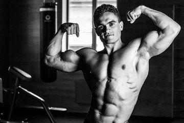 Fototapeta na wymiar Strong Athletic Man Fitness Model Torso showing six pack abs