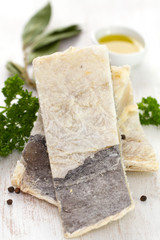dry salted cod fish on white background