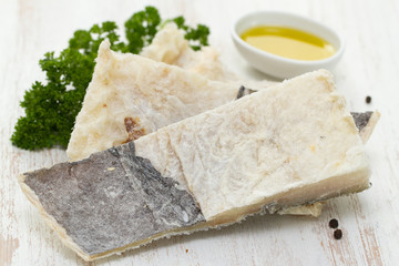 salted cod fish on white wooden background