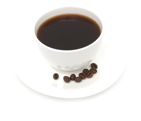 roasted coffee beans with a cup of coffee on a white background