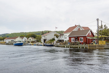 Fototapeta na wymiar boats at a small fishing village in fjord landscape of Norway, Europe 