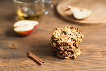 Obraz na płótnie Canvas Useful oatmeal cookies with raisins and cranberries