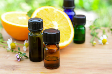 essential oils with orange and herbs