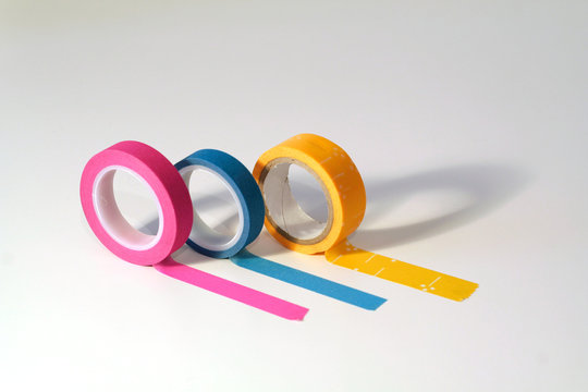 Washi tape rolls, masking tape rolls unrolled. Isolated on white background