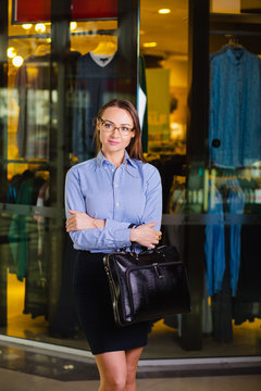Portrait of a attractive Young Businesswoman Holding a briefcase