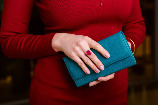 respectable woman holding wallet.