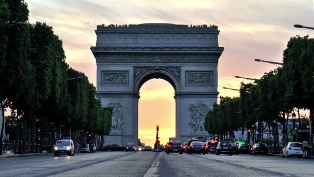 Arc De Triumph at sunset, seen from Champs Elysees, Paris, France