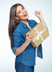 Smiling woman holding gift box. Young model .