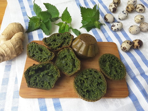 Cooking nettles ginger muffins, organic food with wild plants and quail eggs