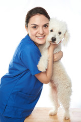 doctor hugging white dog