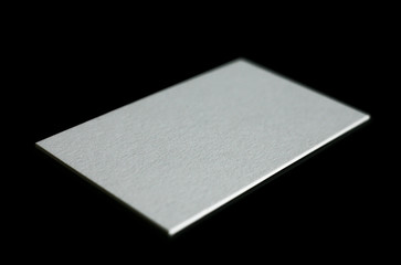 Blank white business cards on a black background. Photo mock-up.
