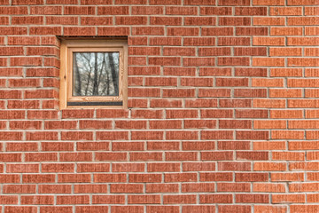 brick wall with a small window