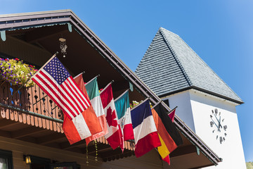 Flags of European and North American countries hanging off of balcony in Vail, Colorado