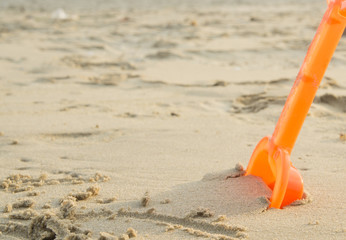 Fototapeta na wymiar sand tool toy play ground orange color