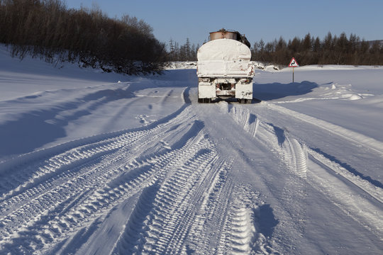 Tanker on the winter road in the snow. Indigirka River. Yakutia. Russia.