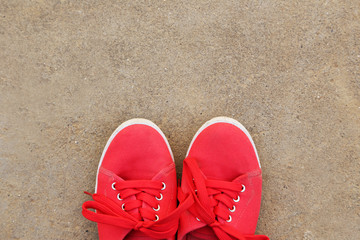Fototapeta na wymiar Pair of red shoes outdoors