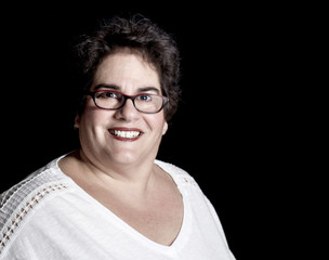 Beautiful Heavy Set Middle-Aged Woman wearing Glasses in Studio