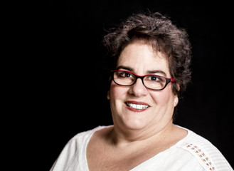 Beautiful Heavy Set Middle-Aged Woman wearing Glasses in Studio