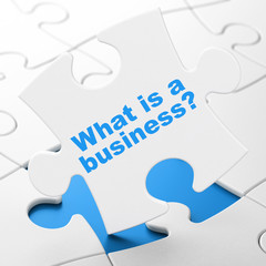 Business concept: What is a Business? on puzzle background