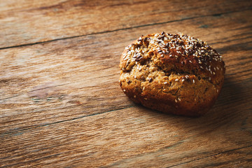 Freshly baked homemade bread on rustic wood background