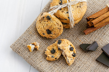 Sweet cookies with chocolate on a table. Biscuits for dessert. Top view, close-up.