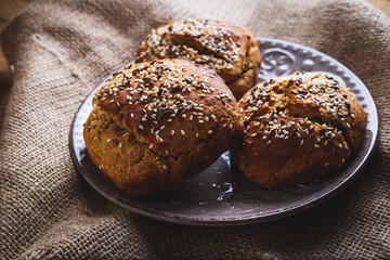 Freshly baked homemade bread on rustic wood background
