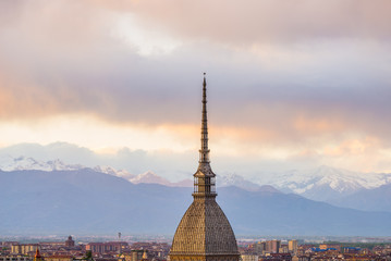 Cityscape of Torino (Turin, Italy) at sunset with storm clouds