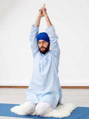 Young yogi  man doing extension